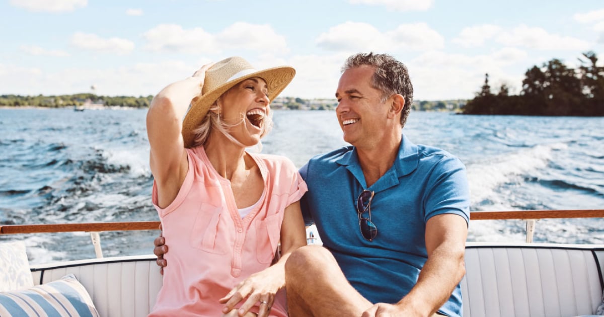 Smiling couple on yacht